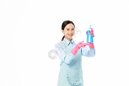 家政服务女性使用洒水器图片素材
